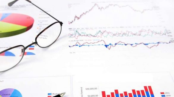 image showing table with graphs and trading chart
