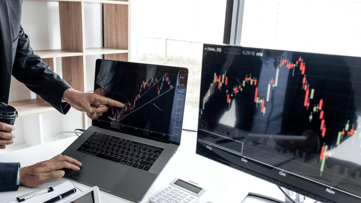 image show computer with trading background