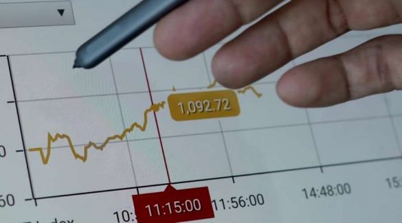 Momentum Trading-min image shows man writing trading